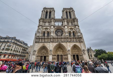 Paris, France - October 2, 2018. People Visit The Notre-dame De Paris. The Cathedral Was Begun In 11