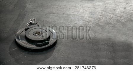 Bunch Of Heavy Black Barbell Weight Plates On The Gym Floor Prepared For Hard Core Fitness Workout S