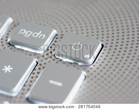 Silver Laptop Power Button Close Up. Shallow Dof