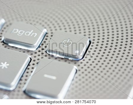 Silver Laptop Power Button Close Up. Shallow Dof