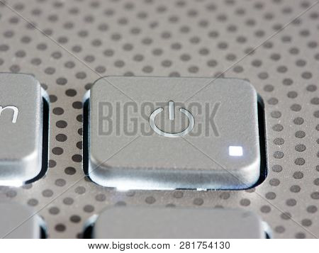 Silver Laptop Power Button Close Up. Shallow Dof
