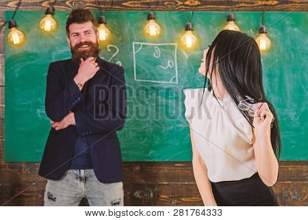 Lady Teacher And Bearded Hipster Schoolmaster Working Together In School. Generation Concept. Man Wi