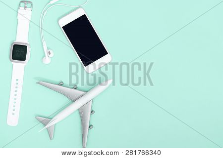 Hi Tech Travel Gadget And Accessories On Blue Teal Copy Space Flat Lay Top View