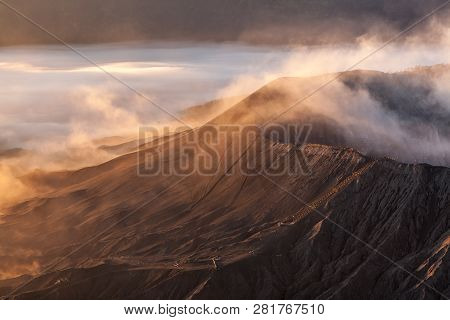 Bromo Volcano Infernal Landscape. Stairway To Hell Concept. Unusual View Down To Smoking Bromo Crate