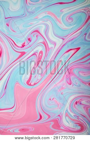 Abstract colored background. Stains of paint on the water. Ebru art, marbled paper.