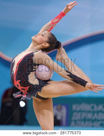 KIEV, UKRAINE - AUGUST 28, 2013: Andreina Acevedo Martinez, Venezuela performs with ball during 32nd Rhythmic Gymnastics World Championships. The event is held in Palace of Sport