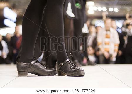 Tap Dance At The Festival. Black Boots On Stage Close-up. Special Shoes Lined With Metal Plates. Sou