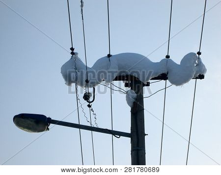 Snow And Ice Covered Electric Pillar In The Winter Freezing Day. Futog Serbia