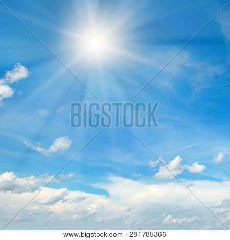 Couds In The Blue Sky. Bright Midday Sun Illuminates The Space .