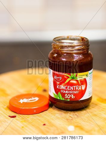Poznan, Poland - January 31, 2019: Polish Kania Tomato Concentrate In A Opened Glass Jar On A Wooden