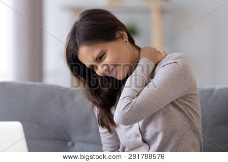 Stiff Neck Concept, Young Woman Feeling Pain Rubbing Tensed Muscles