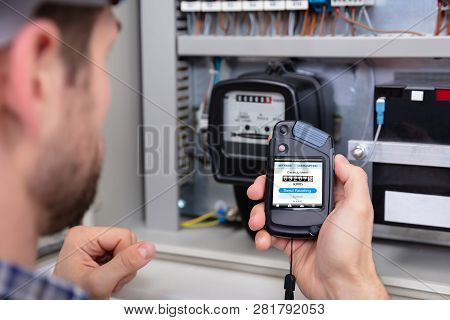 Close-up Of A Male Technician Doing Meter Reading