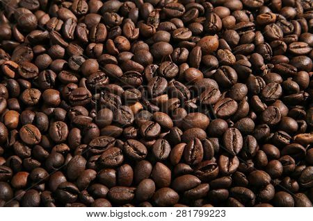 A Scattering Of Coffee Beans. Coffee Background. Closeup.