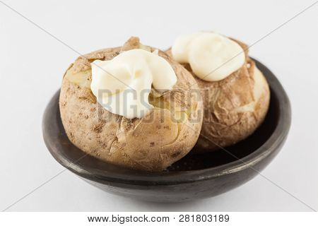 Traditional Colombian Cooked Potatoes Called Papas Saladas Topped With Mayonnaise Isolated On White