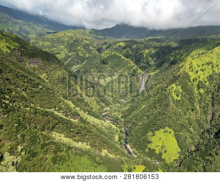Aerial View Of Manawaiopuna Falls And Landscape Of Hawaiian Island Of Kauai From Helicopter Flight