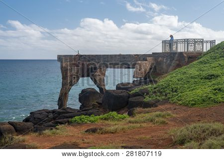 Tourist Stands On The Old Concrete Pineapple Dump Pier By Bicycle Path In Kapaa