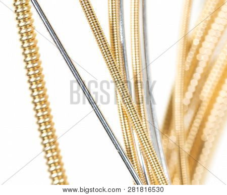 Strings For Guitar Isolated On A White Background. Macro