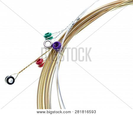 Strings For Guitar Isolated On A White Background. Macro