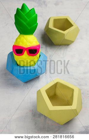 Funny Pineapple Toy In Concrete Pot Top View