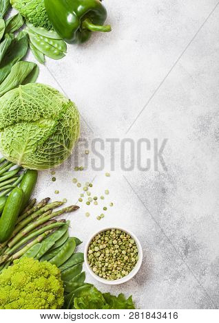 Assorted Green Toned Raw Organic Vegetables On White Background. Avocado, Cabbage, Broccoli, Caulifl