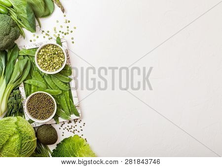 Assorted Green Toned Raw Organic Vegetables On White Background. Avocado, Cabbage, Broccoli, Caulifl