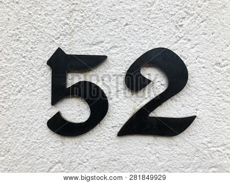 The Number Of Street Address With Number 52 Closeup.