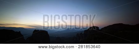 Beautiful Panoramic View Of A Meteora Sunset With Some Of Its Rocks