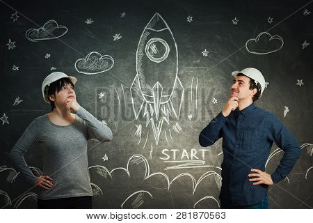 Engineers Scientists Man And Woman Sharing Thoughts Together For Starting A Rocket Space Ship In Cos