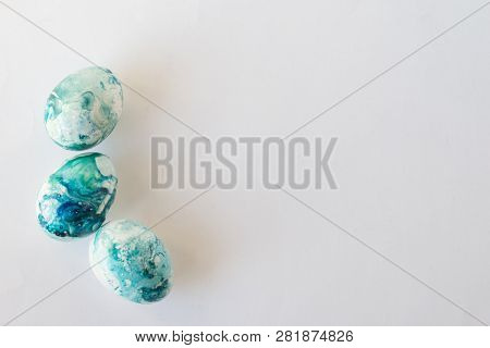 Easter Background With Easter Blue Eggs . Isolated On White. Top View With Copy Space.