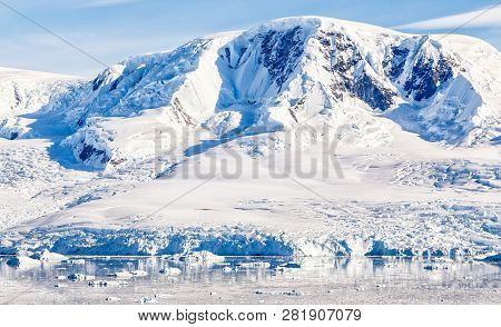Antarctic Mountain Covered With Snow Glacier And Waters With Icebergs, Neco Bay, Antarctica