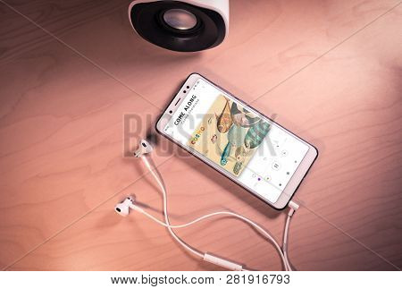 Top View Image Of Smartphone, Earphones And Speaker With Cosmo Sheldrakes Song On Screen