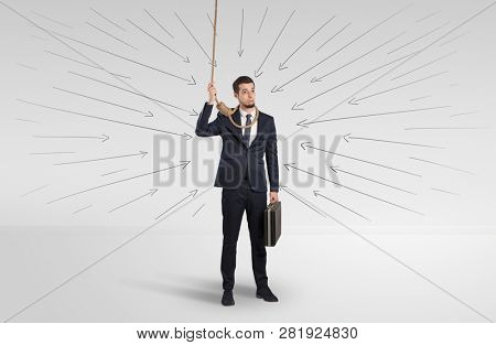 Hopeless young businessman trying to suicide with question signs concept