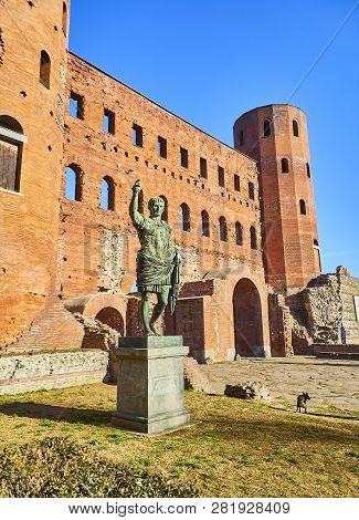 Statue Of Augustus Caesar In Front Of Porta Palatina Gate. Piazza Cesare Augusto Square. Turin, Pied
