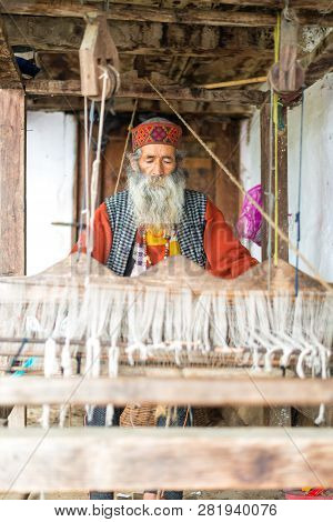 Kullu, Himachal Pradesh, India - August 09, 2018 : Himachali Pattu Saree Weaver On His Loom, Handloo