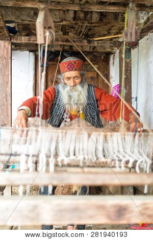 Kullu, Himachal Pradesh, India - August 09, 2018 : Himachali Pattu Saree Weaver On His Loom, Handloo