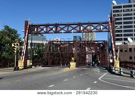 Kinzie Street Drawbridge Over The North Branch Of The Chicago River In Summer Under A Clear Blue Sky