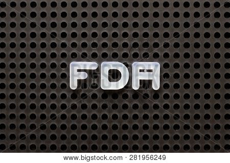 Black Color Pegboard With White Letter In Word Fda (abbreviation Of Food And Drug Administration)