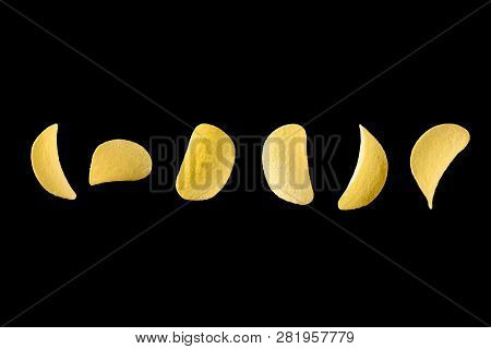 Falling Potato Chips Isolated On Black Background. Levitating Crispy Snacks