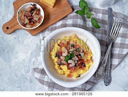 Homemade Shrimp And Grits With Bacon, Chedder Cheese And Parsley In A White Bowl. American Cuisine. 
