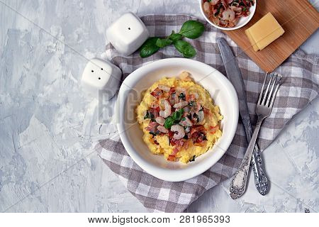 Homemade Shrimp And Grits With Bacon, Chedder Cheese And Parsley In A White Bowl. American Cuisine. 