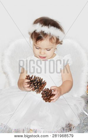 Little Child In The Costume Of An Angel. Selective Focus.
