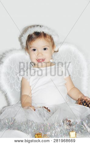 Little Child In The Costume Of An Angel. Selective Focus.