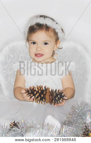 Little Child In The Costume Of An Angel. Selective Focus.