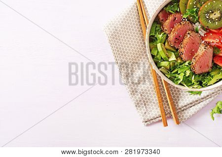 Salad. Poke Bowl. Buddha Bowl. Traditional Salad With Pieces Of Medium-rare Grilled Ahi Tuna And Ses