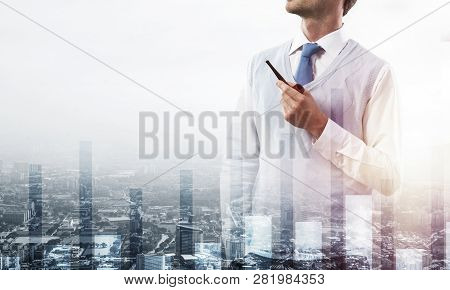 Double Exposure Of Confident And Young Businessman In Smart-casual Wear Smoking Pipe And Modern City