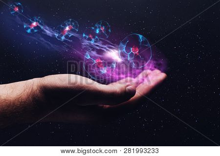 Human Hand Holding Cell Dividing. Nebula Dust. Mixed Media.