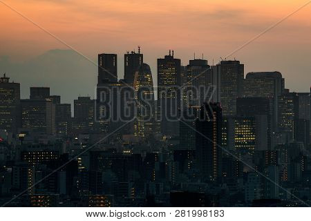 View Of Cityscape Of Tokyo Against Sky And Fuji Mountain During Sunset