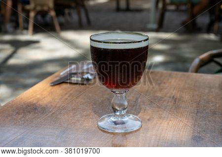 Glasses With Cold Dark Strong Belgian Abbey Beer Served Outdoor