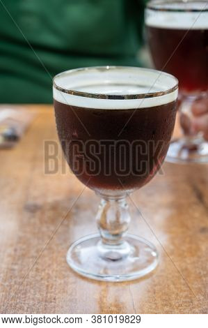Glasses With Cold Dark Strong Belgian Abbey Beer Served Outdoor