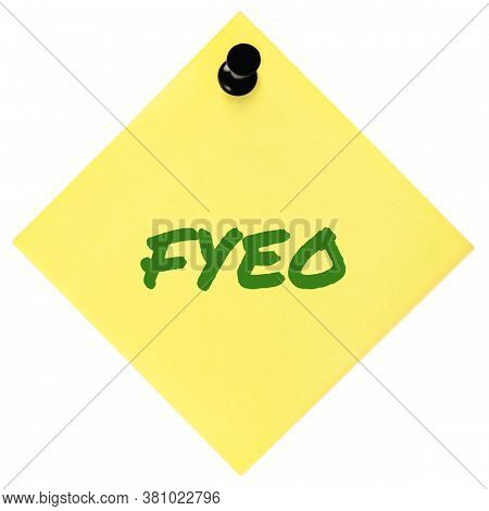 For your eyes only initialism FYEO green marker written acronym text, isolated yellow to-do list sticky post-it note abbreviation sticker, black pushpin thumbtack macro closeup,